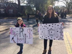 Campers and Volunteers made signs and banners to celebrate Girls Rock in the Mardi Gras Parade! 