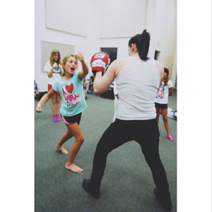 Counselor Mollie teaches campers how to kick butt during a self defense workshop! 